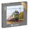 puzzleYOU: 1000-Piece Puzzle of Green Diesel Locomotive 2M62 Pulling a Freight Train view 1