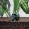 HXSCOO 1.2-Inch Skull Statue, Healing Crystal Skull, Carved Gemstone Decor (Green Ruby) view 1