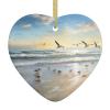 The Beach with Seabirds Heart-Shaped Double-Sided Ceramic Christmas Ornament with Gold Ribbon view 1