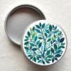 Small Round Metal Container with Green Leaves Design view 2