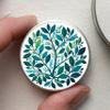 Small Round Metal Container with Green Leaves Design view 3